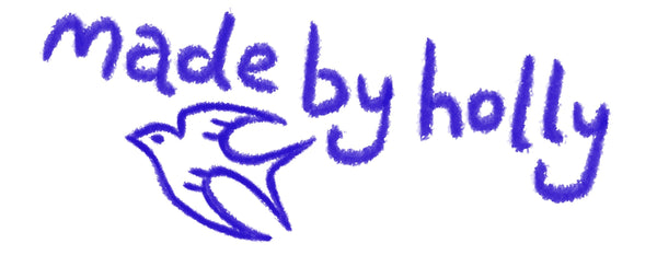 Handwritten 'made by holly' in blue on a white background